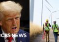 Trump calls climate change a “con job”