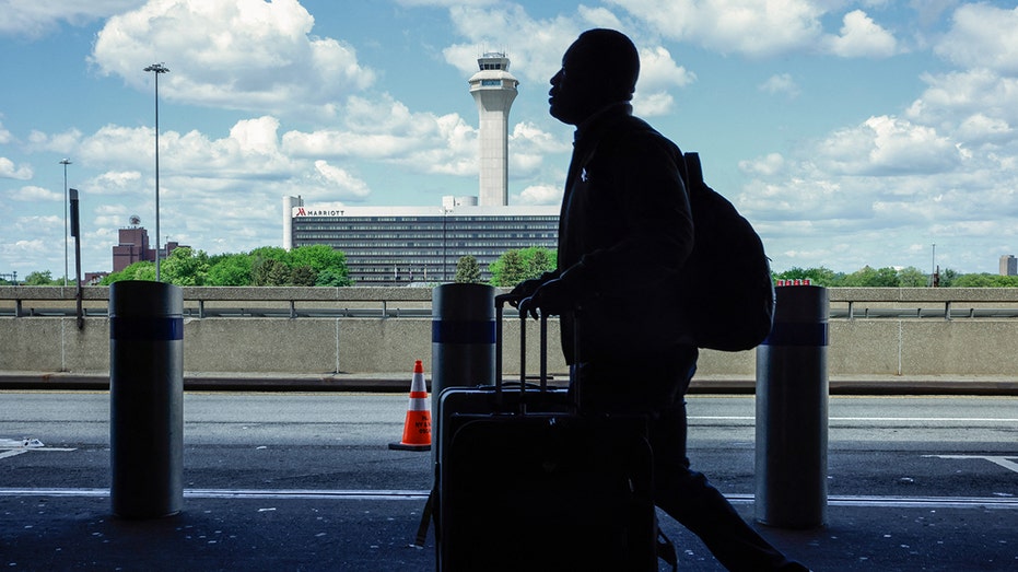 Major airports issue ground stops due to air traffic controller staffing shortages amid government shutdown 5 Newark Airport tower with passenger
