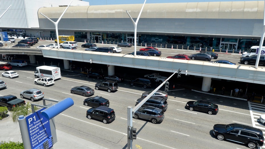 Major US airports face ground stops and flight delays amid ongoing government shutdown 6 Cars outside LAX.