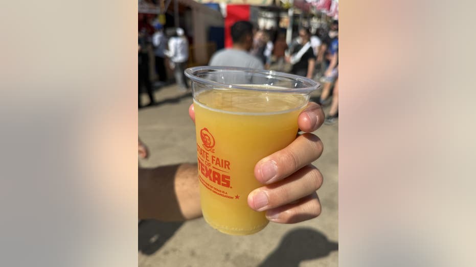 From cotton candy-covered bacon to mustard beer: The most unique eats at the 2025 State Fair of Texas 16 A mustard-flavored beer in a plastic cup.