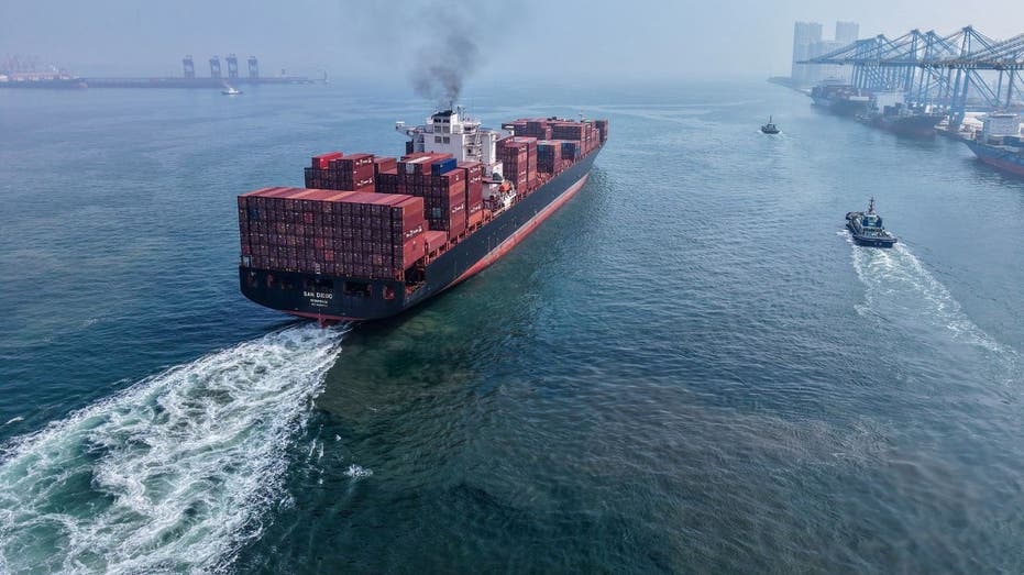 Trump considers historic appearance at Supreme Court tariffs hearing 3 A container ship leaves a Chinese port.