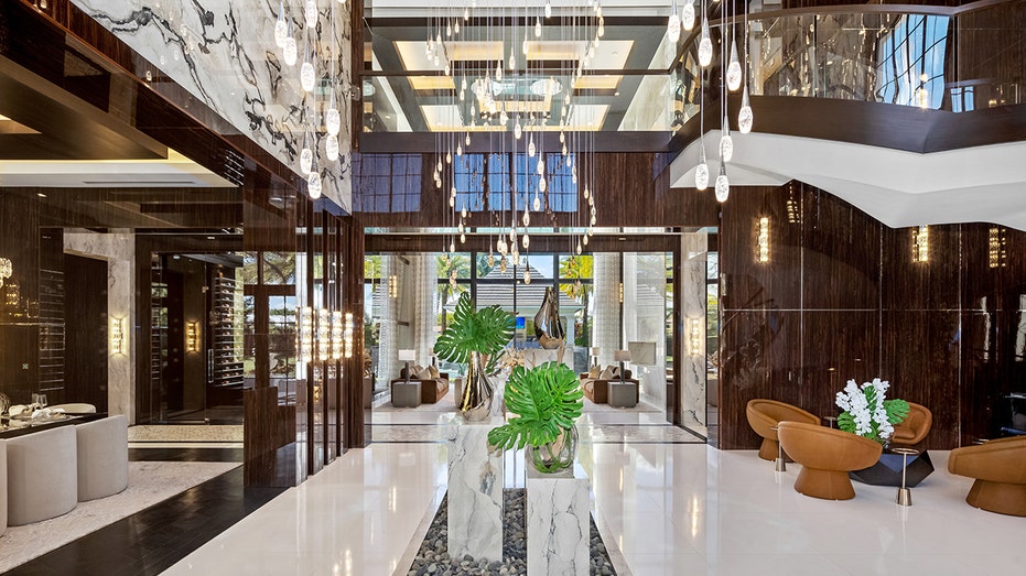 Inside Mark Wahlberg's new $37M Florida sanctuary as celebrities continue exodus from California 10 Delray Beach mansion grand foyer