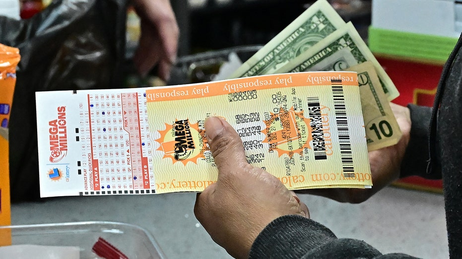 Single ticket sold in Georgia captures $980M Mega Millions jackpot 5 Closeup of Mega Millions tickets and cash