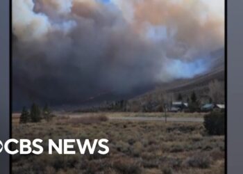 California wildfire forces evacuations and storms trigger mudslides concerns