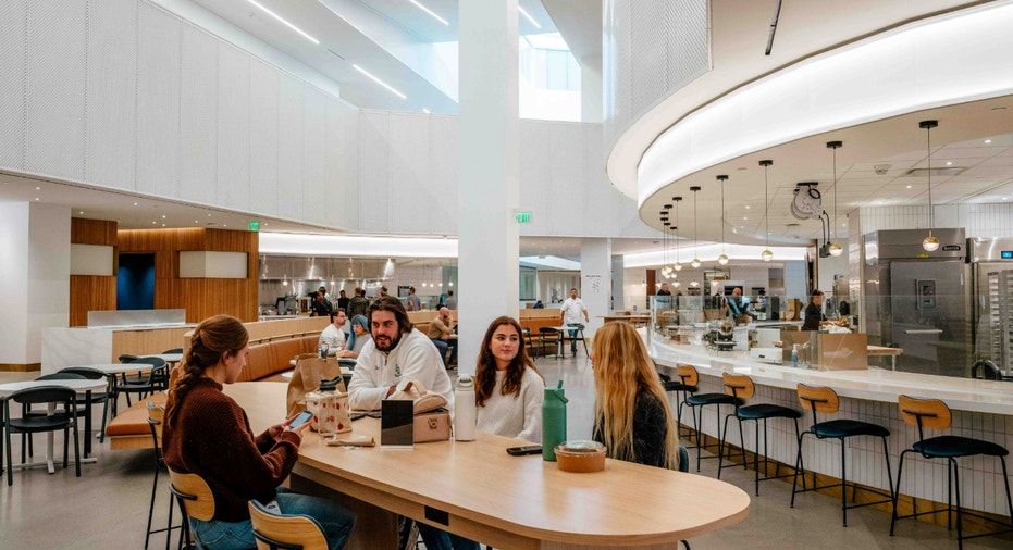 See inside Ford’s new world headquarters, where innovation meets design 13 People sit down at the Ford World Headquarters food hall.