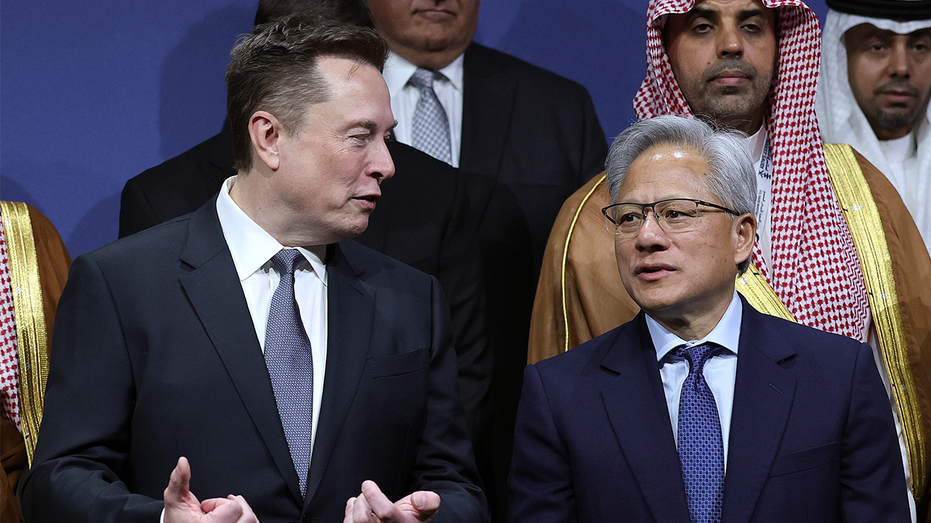 Musk predicts 'money will stop being relevant in the future' as AI, robotics progress 6 Tesla CEO Elon Musk (L) talks with Nvidia CEO Jensen Huang during the U.S.-Saudi Investment Forum at the Kennedy Center on November 19, 2025 in Washington, DC.