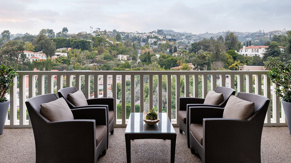 Ozzy Osbourne's Los Angeles condo listed at $2.37M following his death 14 A terrace with two chairs.