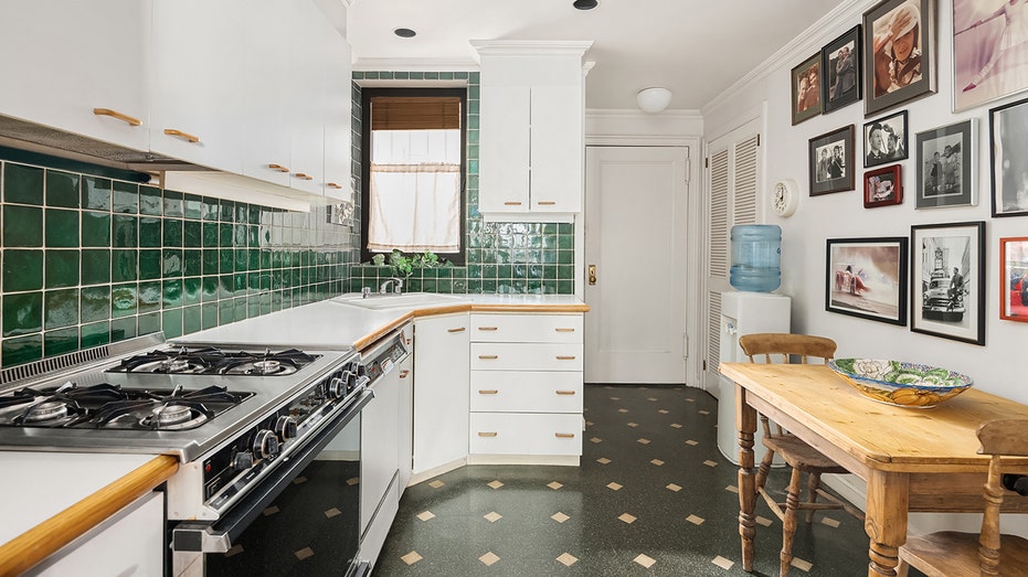 Paul Newman and Joanne Woodward's New York apartment hits market for first time in 40 years for $1.69M 15 The kitchen features green tiled backsplash and a dining area.