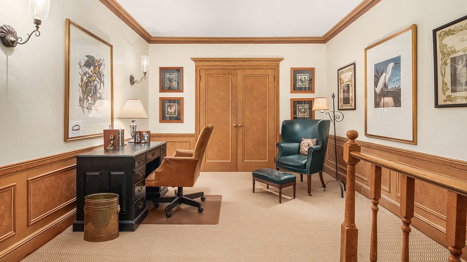 Paul Newman and Joanne Woodward's New York apartment hits market for first time in 40 years for $1.69M 16 An office with a black desk and a green lounge chair in the corner.